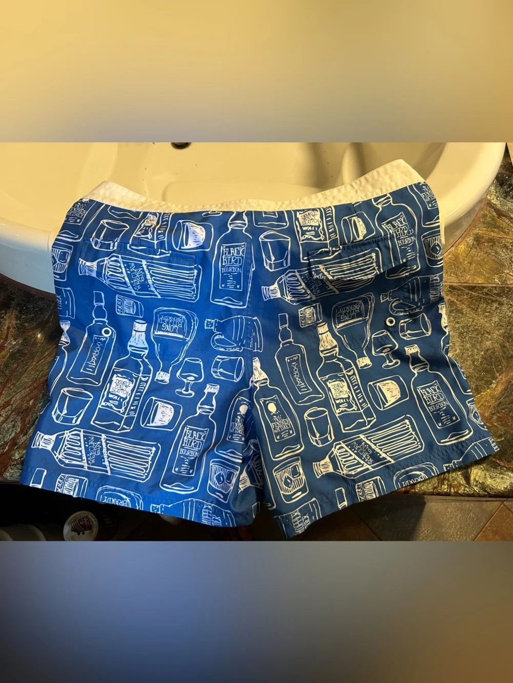 Penguin blue men’s swim trunk alcohol bottles, size 34